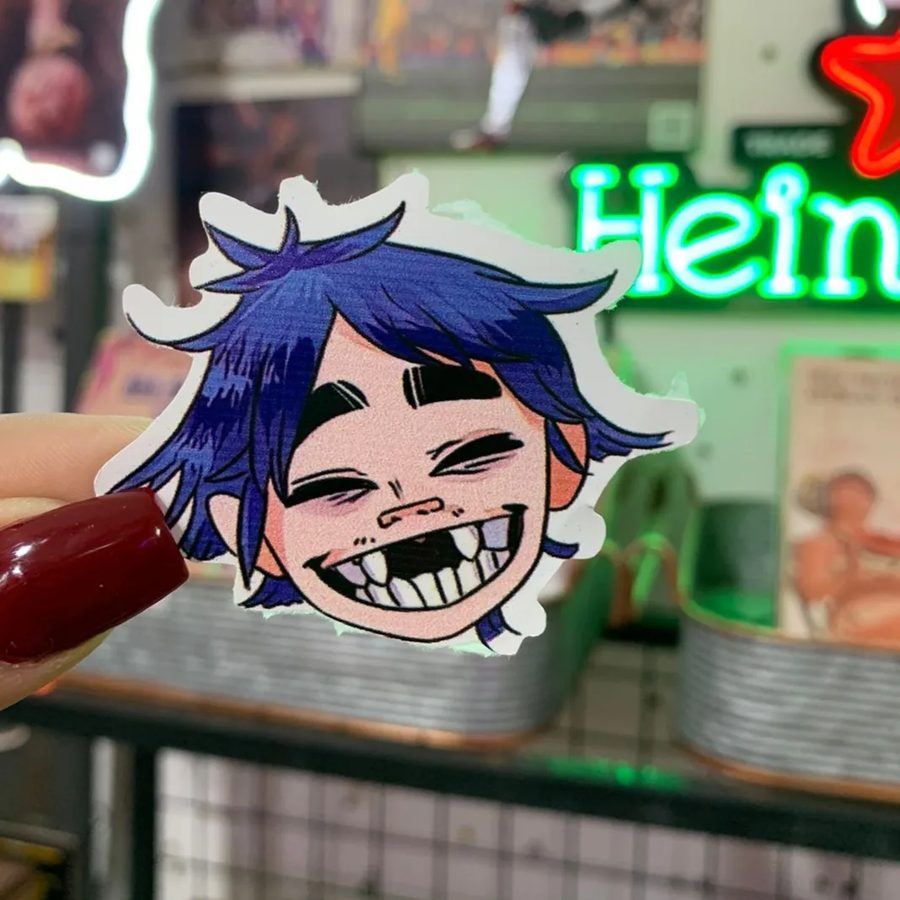 Personaje animado de pelo azul sonriente