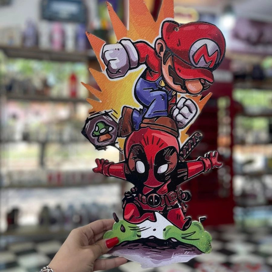 Cartel Mario Bros y Deadpool