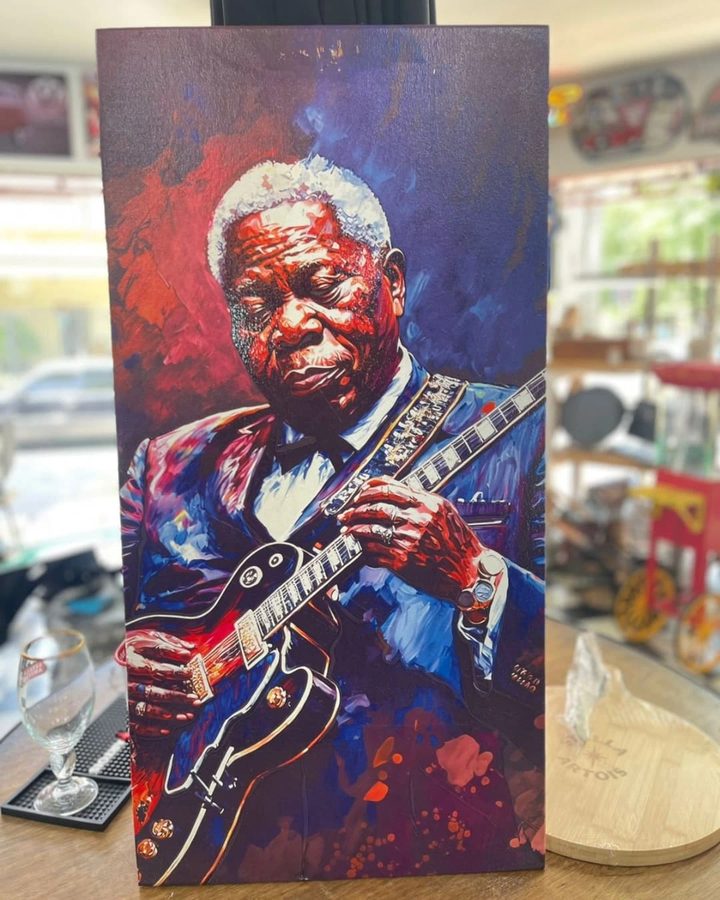 Cuadro Guitarrista de traje azul tocando
